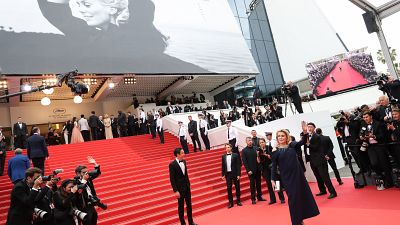 Queen of the Cannes red carpet - the legendary Catherine Deneuve poses with this year's poster