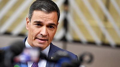 Spain's Prime Minister Pedro Sanchez speaks with the media as he arrives for an EU summit in Brussels, on Oct. 20, 2022.