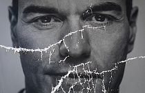 A partially damaged poster of Spanish Prime Minister and Socialist Party candidate Pedro Sanchez.