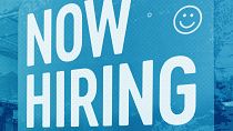 A hiring sign is displayed at a fast food restaurant in Northbrook, IL, May 2023