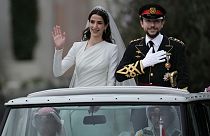 The Crown Prince and Princess of Jordan parade through the streets of Amman after marrying at Zahran palace