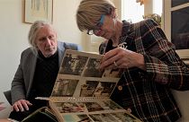 Kjell Sundstedt and his cousin Karina Sjöberg with a photo album of their family, who were sterilised in Sweden.
