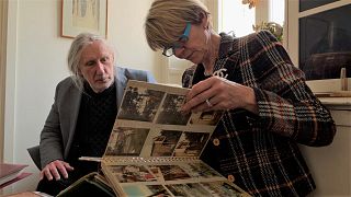 Kjell Sundstedt and his cousin Karina Sjöberg with a photo album of their family, who were sterilised in Sweden.