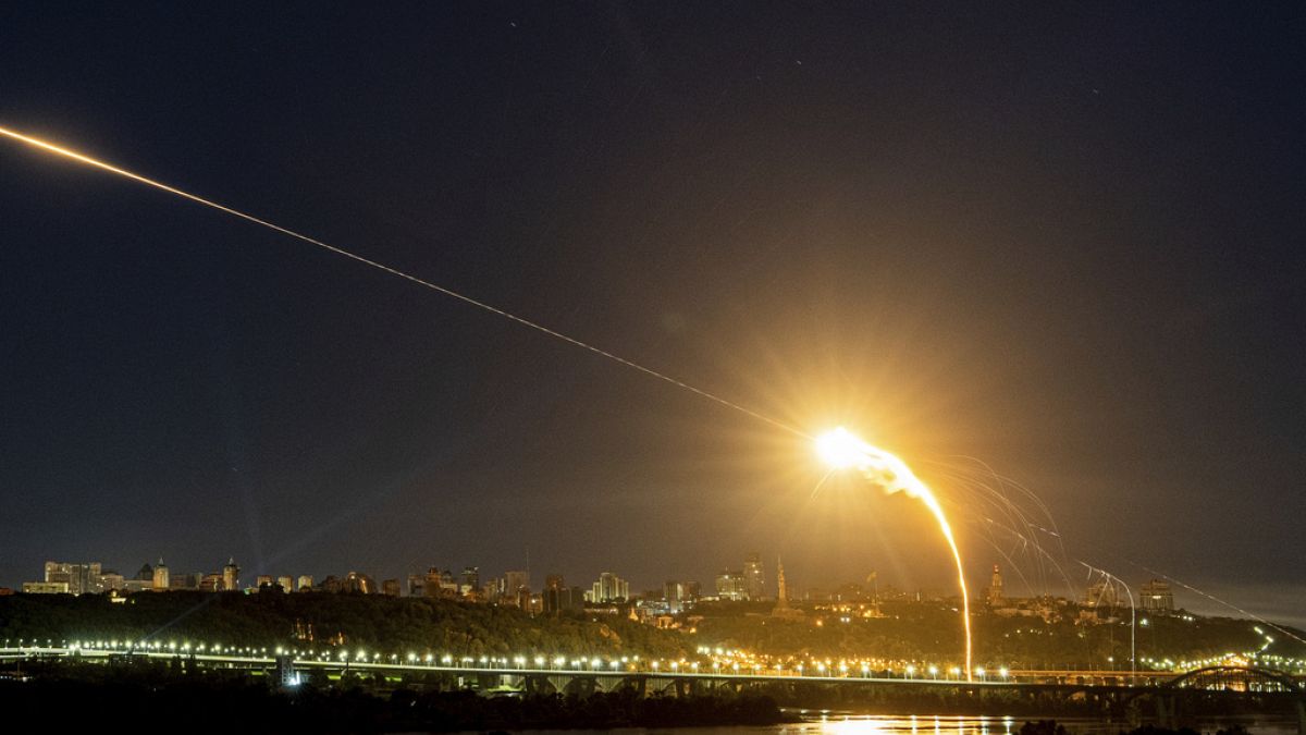 FILE - Ukrainian air defense intercepts a Shahed drone mid-air in the third Russia aerial attack on the capital in the last 24 hours in Kyiv, Ukraine, Tuesday, May 30, 2023.