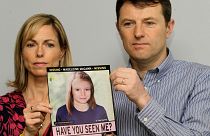 Kate and Gerry McCann pose for the media with a missing poster depicting an age progression computer generated image of their still missing daughter Madeleine.