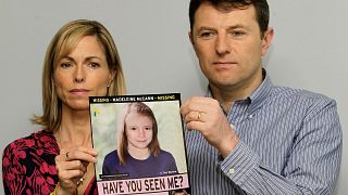 Kate and Gerry McCann pose for the media with a missing poster depicting an age progression computer generated image of their still missing daughter Madeleine.