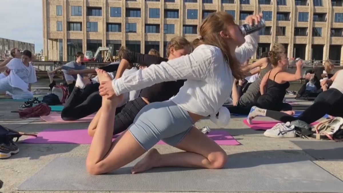 Watch: Booze and balance unite in beer yoga gathering!