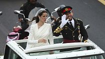 Jordan's Crown Prince Hussein and his bride wave to well-wishers