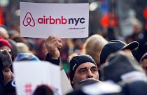 Supporters of Airbnb hold a rally outside City Hall in New York.