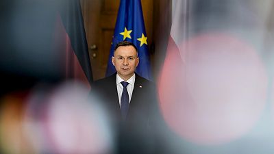 Polish President Andrzej Duda defended the controversial law but offered changes to address the growing criticism.
