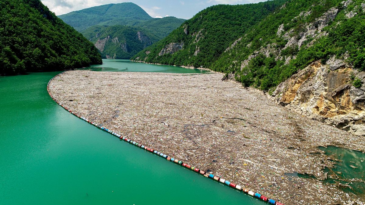 Rubbish collected in a barrier by a hydroelectric dam on the Drina river, Bosnia & Herzegovina