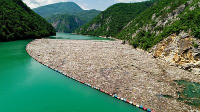 Rubbish collected in a barrier by a hydroelectric dam on the Drina river, Bosnia & Herzegovina
