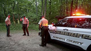 Authorities secure the entrance to Mine Bank Trail, an access point to the rescue operation along the Blue Ridge Parkway.