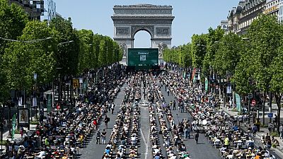 Paris' most iconic street, the Champs-Elysees, was transformed into an open-air mass "dictation" spellathon, Sunday 4 June 2023