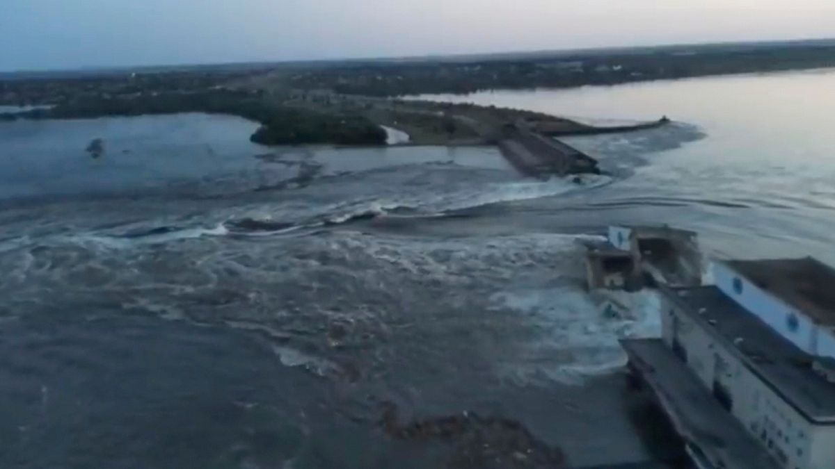 Image released by the Ukrainian Presidential Office, water runs through a breakthrough in the Kakhovka dam in Kakhovka, Ukraine, Tuesday, June 6, 2023