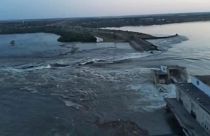 Image released by the Ukrainian Presidential Office, water runs through a breakthrough in the Kakhovka dam in Kakhovka, Ukraine, Tuesday, June 6, 2023