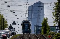A tram drives away from the European Central Bank in Frankfurt, Germany, May 17, 2023. 
