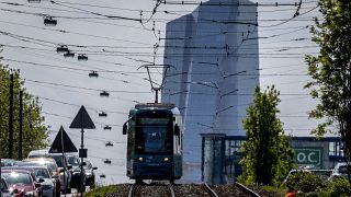 A tram drives away from the European Central Bank in Frankfurt, Germany, May 17, 2023. 