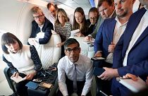 Britain's Prime Minister Rishi Sunak holds a meeting with political journalists on board a government plane as he heads to Washington DC