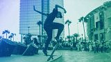 A youth skateboards as campaigners hold a rally for the upcoming legislative and regional elections in Rabat, September 2021
