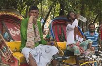 Thirsty work: bicycle rickshaw drivers pause for a break as Bangladesh swelters in a heatwave. June 6, 2023