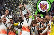 West Ham's Declan Rice lifts the trophy after winning the Europa Conference League final soccer match between Fiorentina and West Ham at the Eden Arena in Prague, Wednesday.