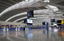 Terminal 5 at Heathrow Airport in London stands empty of passengers as staff standby to help. 
