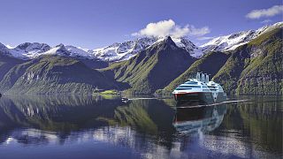 A visual concept visualization of Hurtigruten Norway's zero-emission Sea Zero ship in Hjørundfjord, Norway.