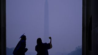 Purple haze: high school graduates take a selfie on the Washington monument as smog from Canadian wild fires engulgs the US capital. June 8, 2023