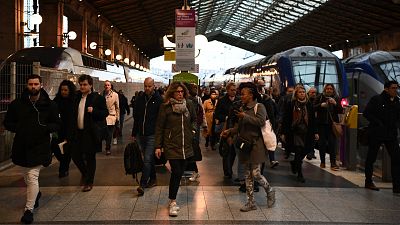 Travellers walk at Gare du Nord train station in Paris.