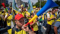 Striking teachers blow horns in Bucharest, Romania