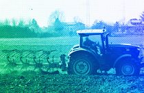 A farmer plows a field with his tractor in Cisliano, March 2022