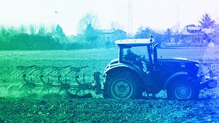 A farmer plows a field with his tractor in Cisliano, March 2022