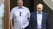 Russian President Vladimir Putin and Belarusian President Alexander Lukashenko walk during their meeting at a resort city of Sochi,