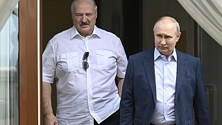 Russian President Vladimir Putin and Belarusian President Alexander Lukashenko walk during their meeting at a resort city of Sochi,