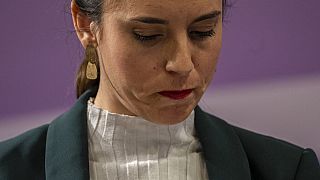 Spain's Equality Minister Irene Montero looks down during a press conference.