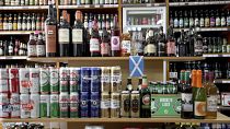 Shelves of alcoholic drinks are displayed for sale in an Edinburgh off-licence.