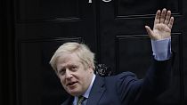Britain's Prime Minister Boris Johnson returns to 10 Downing Street after meeting with Queen Elizabeth II at Buckingham Palace, London, on Friday, Dec. 13, 2019.