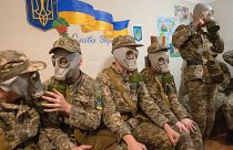 Cadets practice with gas masks during a lesson in a bomb shelter in a cadet lyceum in Kyiv