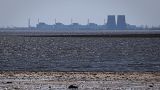 The Zaporizhzhia nuclear power plant is seen in the background of the shallow Kakhovka Reservoir.