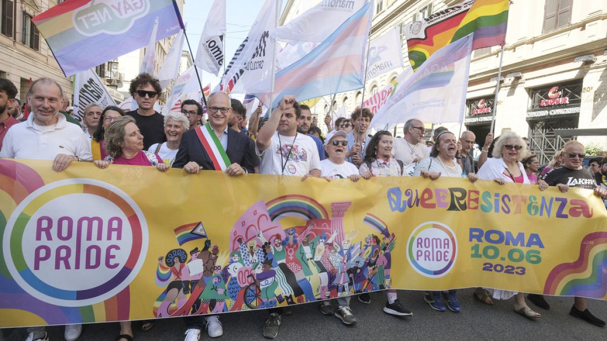 Rome Mayor Roberto Gualtieri, wearing the three colour band of the Italian flag, joins the LGBTQ+ Pride parade in Rome, Saturday, June 10, 2023. 