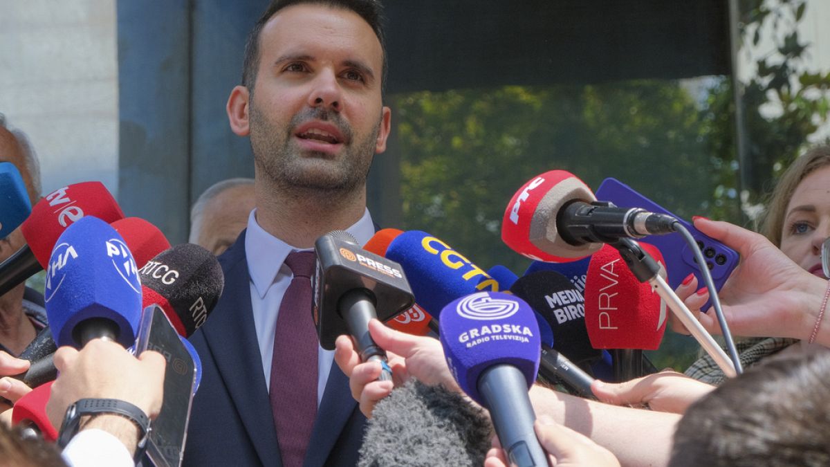 Milojko Spajic, president of the centrist Europe Now party talks to the media after voting at the polling station in Montenegro's capital Podgorica, Sunday, June 11, 2023.