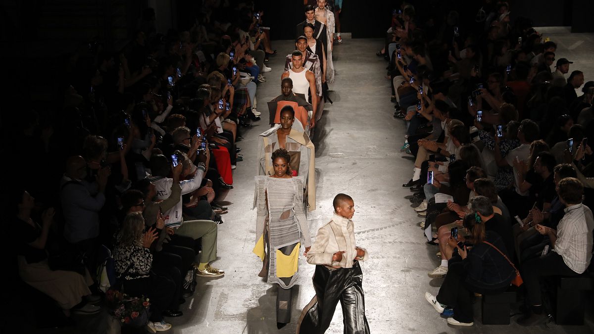 Models walk the runway at the University of Westminster BA Fashion Design show during London Fashion Week June