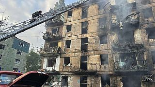 A fire after missiles hit a multi-story apartment building in Kryvyi Rih, Ukraine, Tuesday, June 13, 2023. 