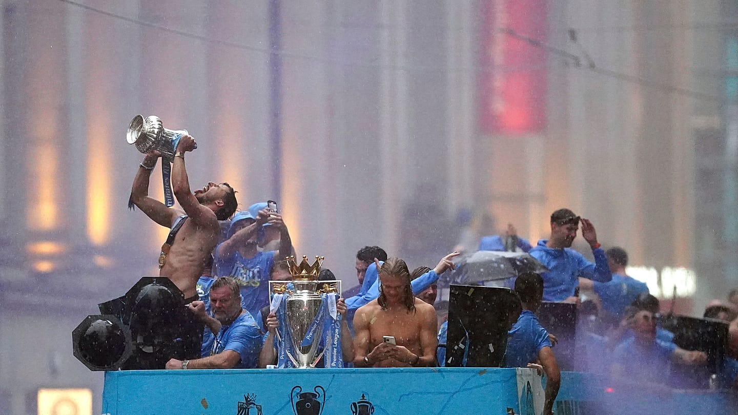 Rain and champagne: Man City celebrate treble glory with fans