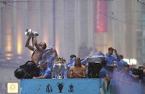 Manchester City's Ruben Dias and Erling Haaland celebrate during the parade to celebrate winning the Premier League, FA Cup and Champions League in Manchester, 12 June 2023