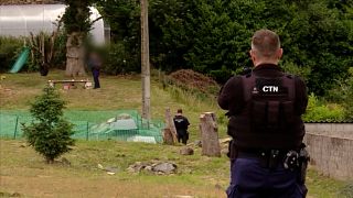 Police surveille the scene where an 11 year-old girl was shot by their neighbour in Saint-Herbot, France