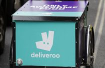 A deliveroo logo is seen on a bicycle in London, July 11, 2017.