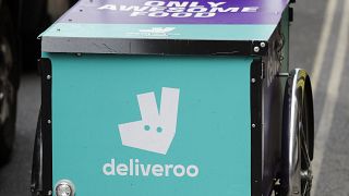 A deliveroo logo is seen on a bicycle in London, July 11, 2017.
