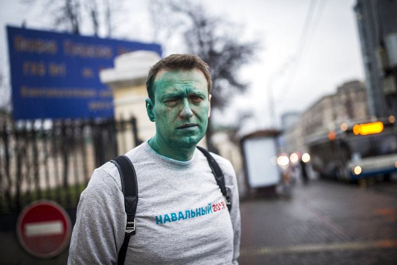 Thursday, April 27, 2017, Russian opposition leader Alexei Navalny poses for a photo after unknown attackers doused him with green antiseptic.